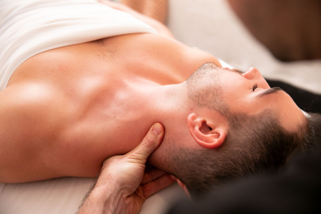 man receiving therapeutic massage from PT Direct